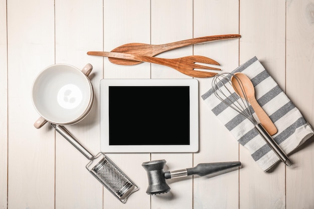 kitchen countertop with utensils and phone